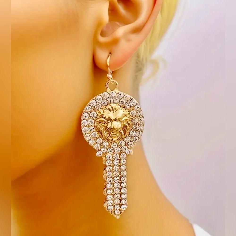 Gold lion-head key earrings with rhinestone embellishments